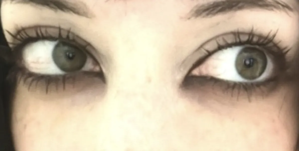 Close-up of smudged dark eye makeup with black waterline