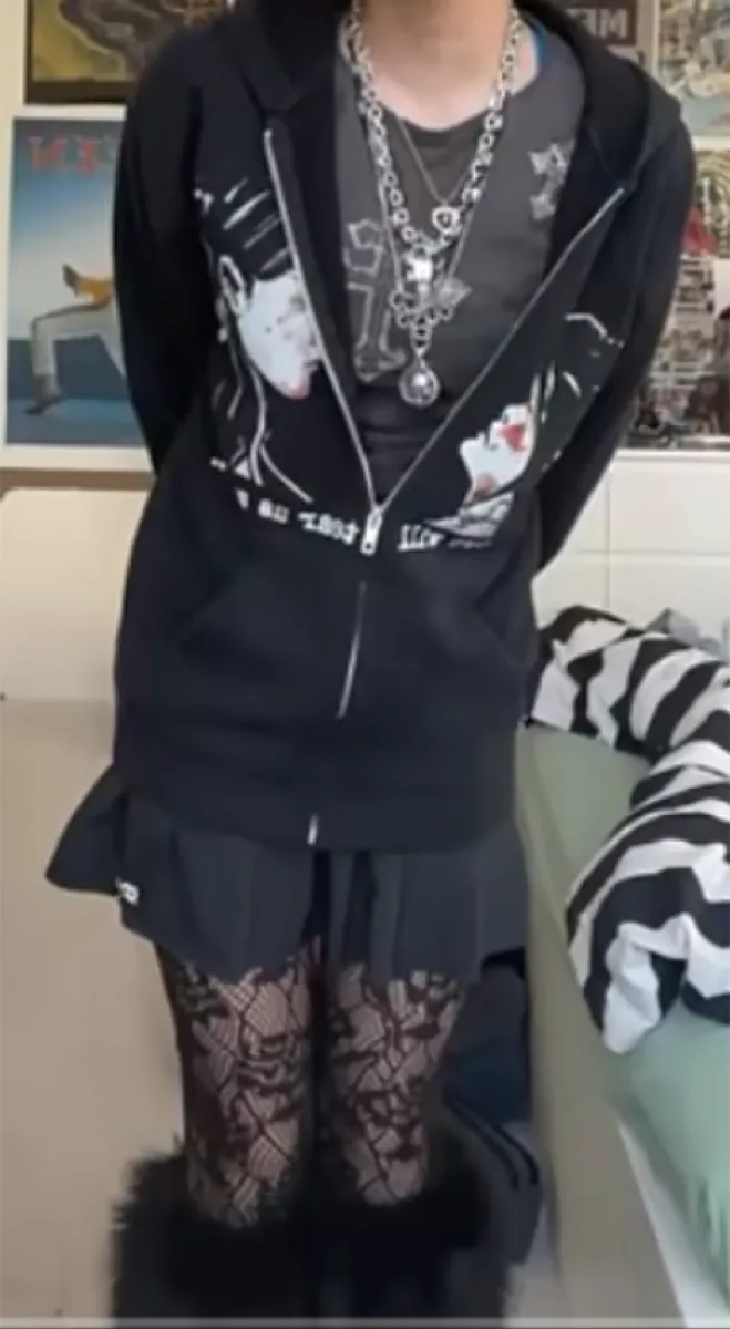 Outfit with layering — band tee, vest, skirt, lace tights, puffy boots